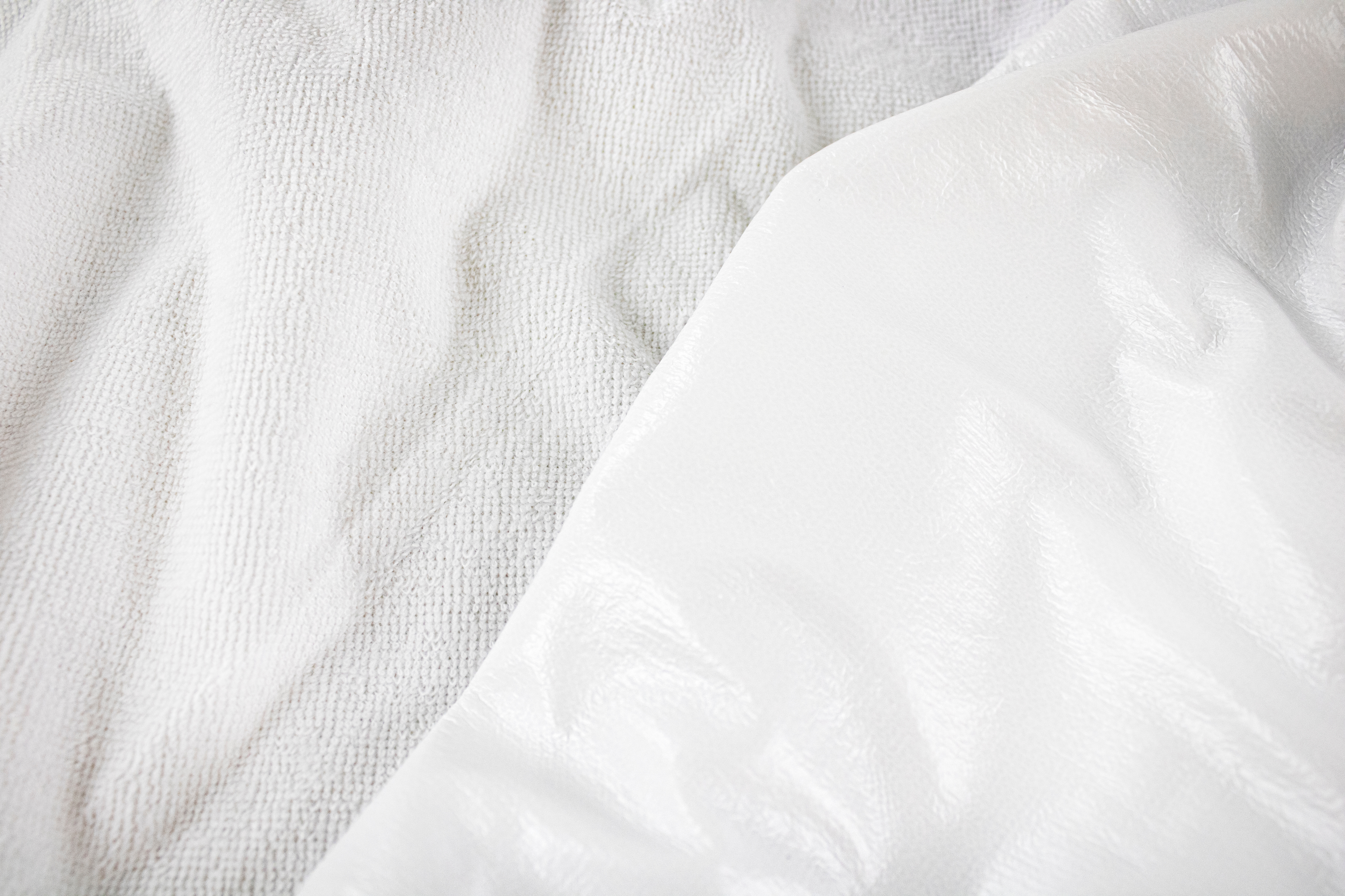 White texture close-up of material for making waterproof mattres Premium Waterproof Mattress Protector by Renee Taylor King - Image 1