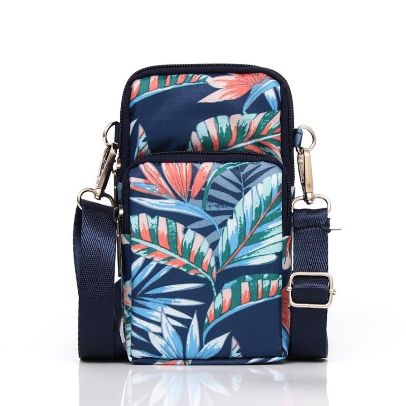 V562-4124774060DBT-202505191612-00 Animal Park Mini Crossbody Phone Wallet With Arm Band - Blue Leaf - Image 1
