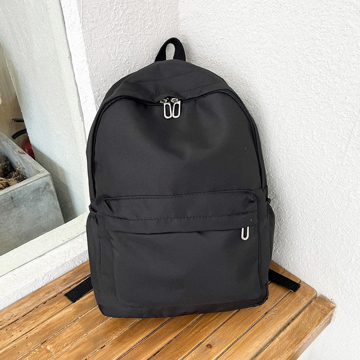 V562-A1021815060DBT-202505191716-00 Simple Women Travel Backpack Solid Colour - Black - Image 1