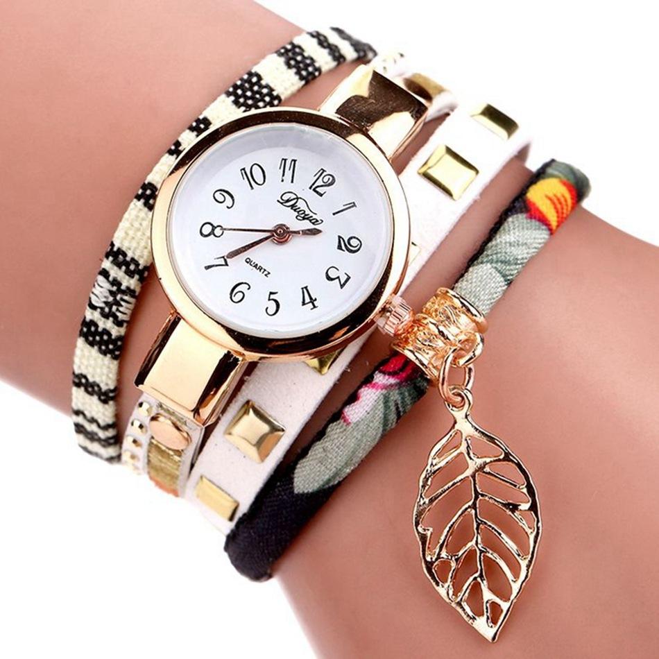 V562-A1053857550DBT-202505271121-00 Leaf Pendant Quartz Bracelet Watch for Women - White - Image 1