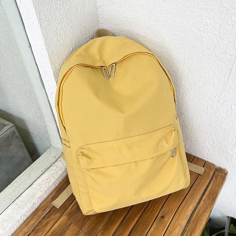 V562-C1021815060DBT-202505191716-00 Simple Women Travel Backpack Solid Colour - Yellow - Image 1
