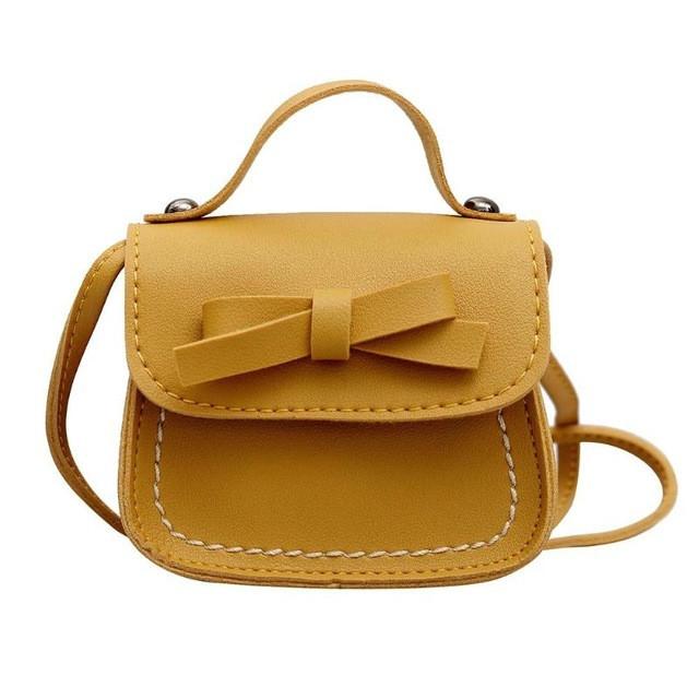 V562-C1064230020DBT-202505191446-00 Mini Bowknot Pu Leather Baby Girls Messenger Bag - Yellow - Image 1
