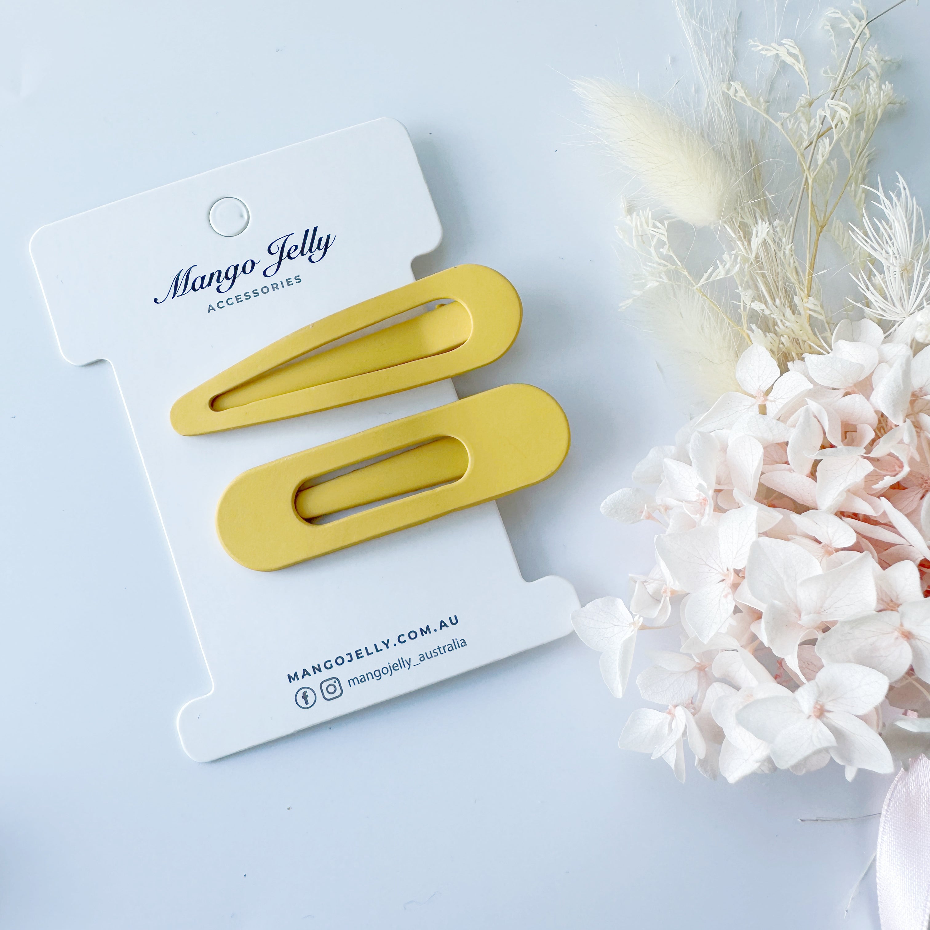 V659-HC-PASTELCOATED-ALI-MUSTARD-2-L-160761-00 MANGO JELLY Large Pastel Coated Hair Clips - Mustard - Twin Pack - Image 1