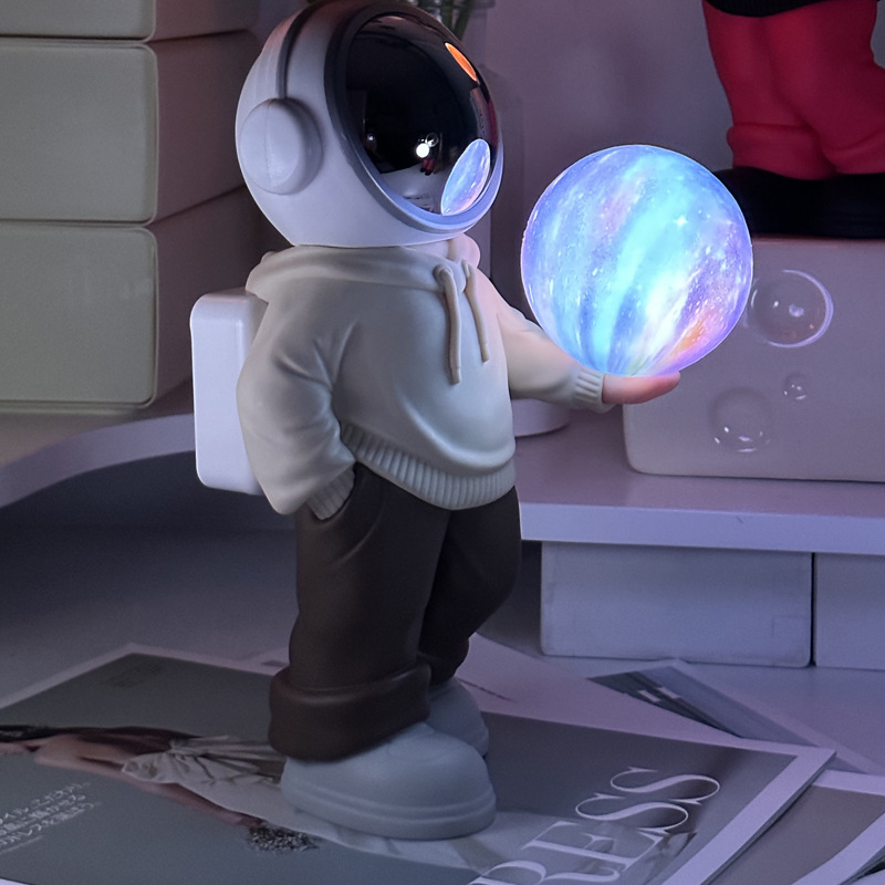 V888-ELOSUNG13499-211781-00 Holding a dreamy starry sky (beige top + brown pants) Creative Astronaut Bluetooth Speaker with 3D Starry Sky Lighting, Portable Wireless Moon Lamp Speaker -Perfect Gift for Space Enthusiasts - Image 1
