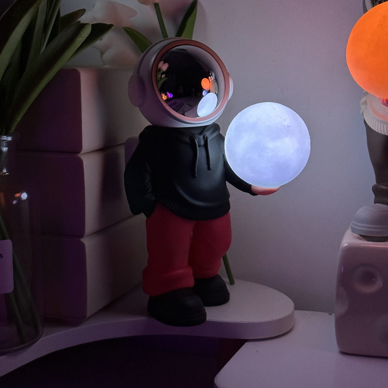 V888-ELOSUNG13503-211789-00 Holding the romantic moon (black top + red pants) Creative Astronaut Bluetooth Speaker with 3D Starry Sky Lighting, Portable Wireless Moon Lamp Speaker - Perfect Gift for Space Enthusiasts - Image 1