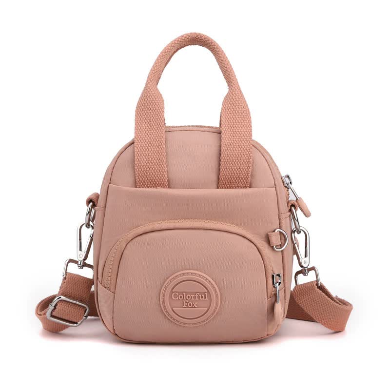 V888-ELOSUNG15534-214199-00 Pink Mini Waterproof Nylon Backpack - Lightweight Casual Crossbody Bag - Image 1