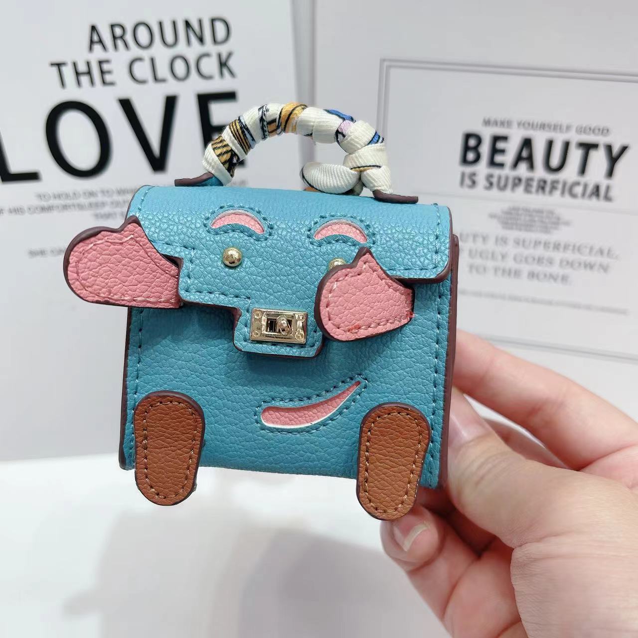 V888-ELOSUNG22110-202503181020-00 Blue Mini Bag Earphone Case - Stylish Keychain Pouch for Headphones - Image 1