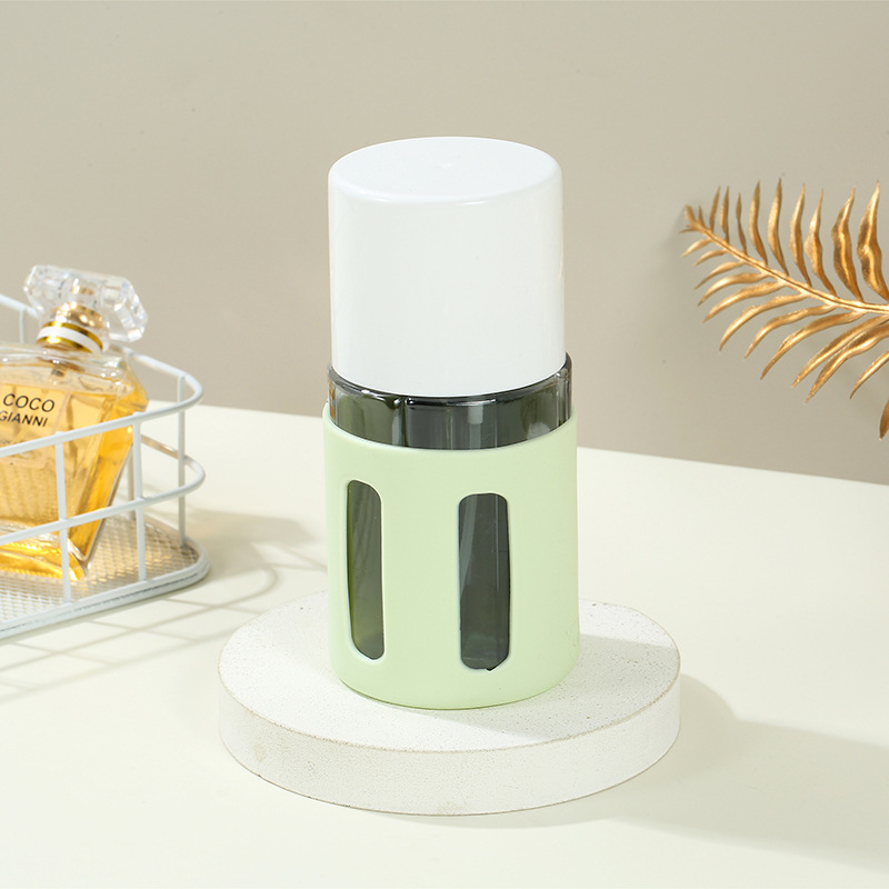 V888-ELOSUNG22540-202503271159-00 Round Green 2-Piece 4-in-1 Travel Dispenser Set-Leakproof Refillable Bottles for Toiletries - Image 1