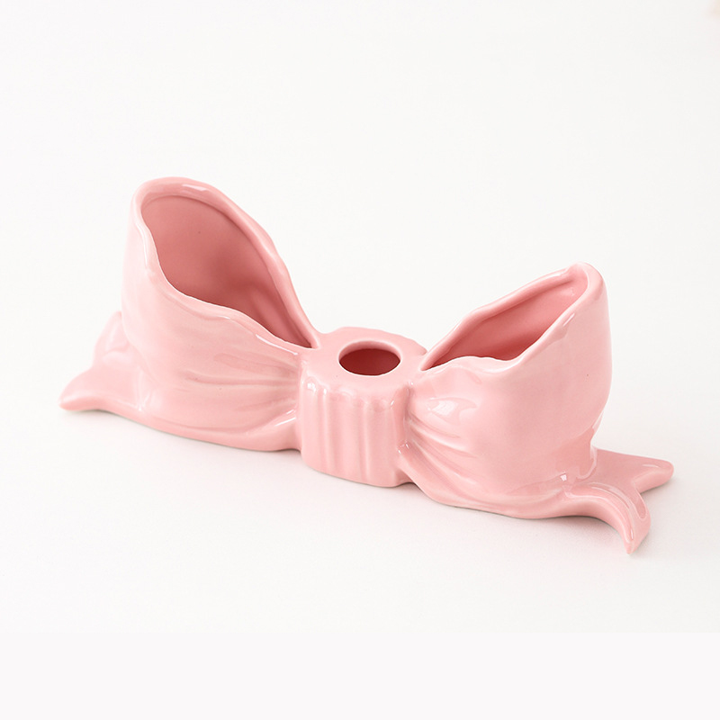V888-ELOSUNG27211-202504281606-00 Pink Elegant Ceramic Bow Taper Candle Holder - Stylish Tabletop Decor Accent - Image 1
