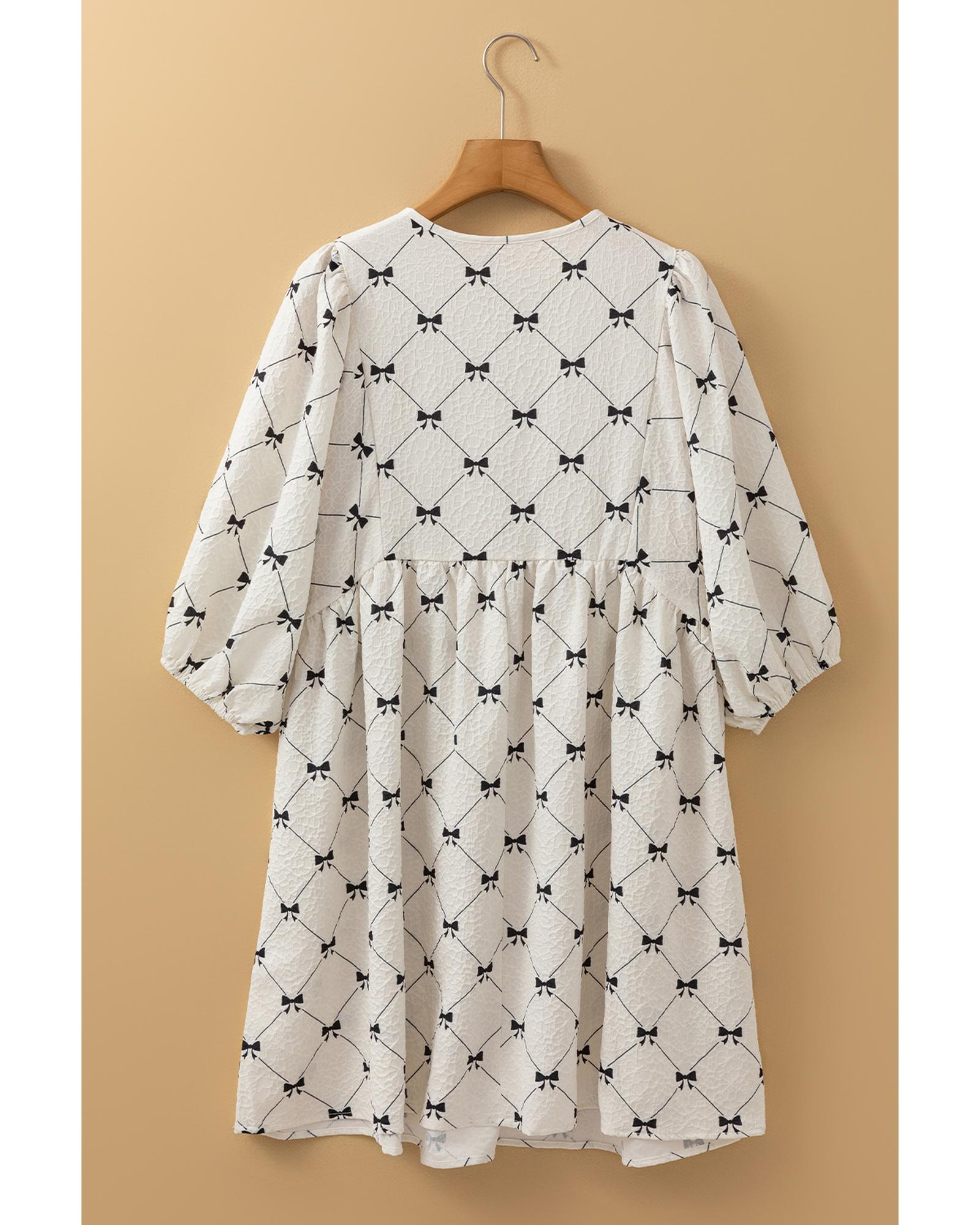 V539-AZEXDC6122762-P120-S-202506190317-00 White Bowtie Pattern Textured Puff Half Sleeve Loose Mini Dress - S - Image 1