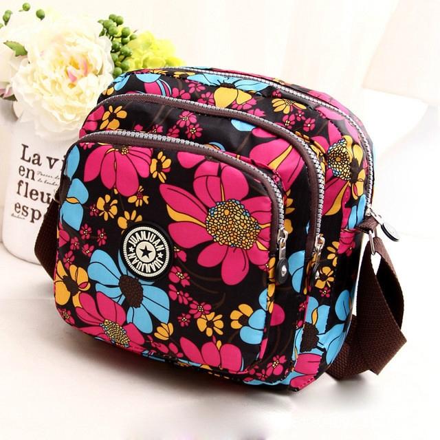 V562-E1039221110DBT-202508291131-00 Waterproof Nylon Multilayer Crossbody Bag For Women - Red Flower - Image 1