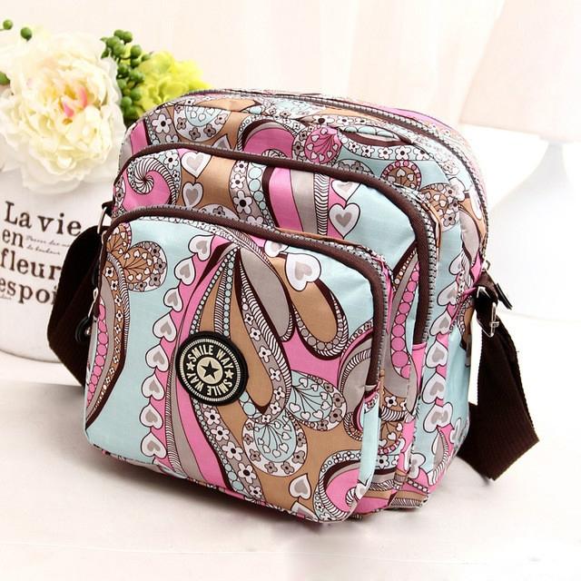 V562-G1039221110DBT-202508291130-00 Waterproof Nylon Multilayer Crossbody Bag For Women - Colourful Streamline - Image 1